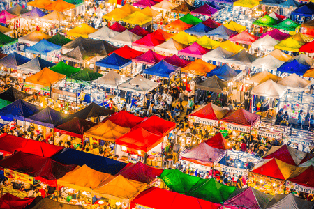 An aerial view of colorful tents at a night market