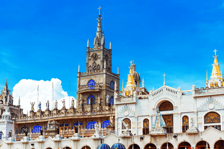 The top level of Simala Shrine facade with religious statues