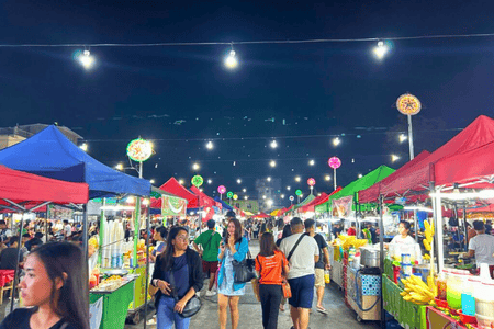 Colon Night Market lined with food stalls and bustling with people