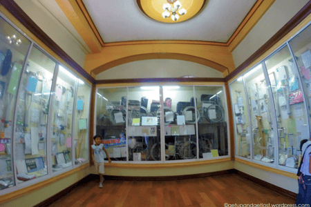Relics roomwith letters, crutches, wheelchairs, and other items left by devotees