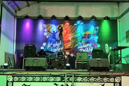 Tambayan Food Park stage with a live band set up for music and entertainment