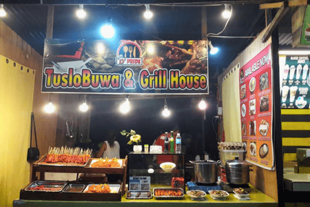 A food stall at BRIC Food Park with grilled meat on skewers on display