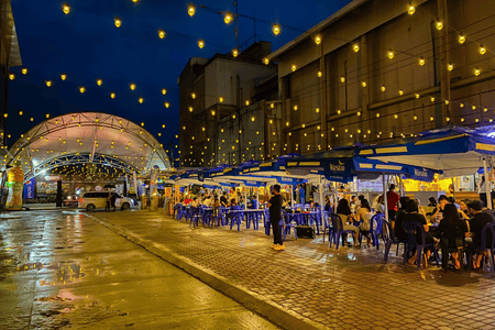 People spending time and enjoying food at Flambe Alley Food Park in Mandaue City, Cebu
