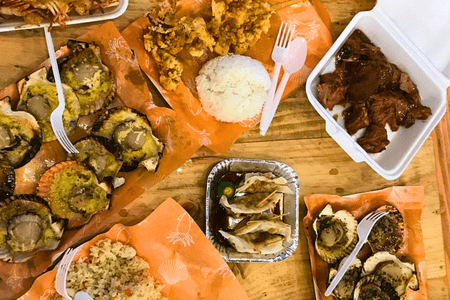 A mix of food offered at The Market: Cebuano dish "humba," grilled scallops, fried chicken with rice, and dumplings