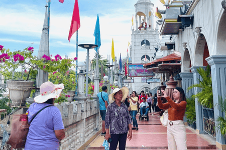 People taking pictures at the Simala Shrine