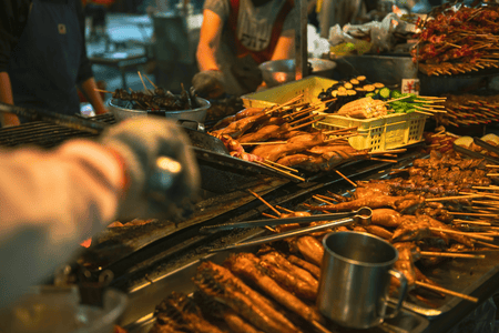 A variety of skewered meat and seafoods displayed at a local night market