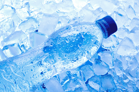 A bottle of water on ice