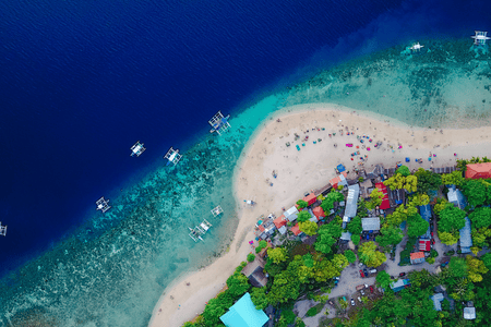 aerial view of the beach and a coastal town in Cebu