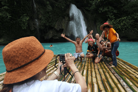 tourists posing for a photo at Kawasan falls