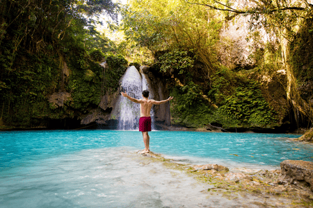 tourist enjoying the Kawasan falls