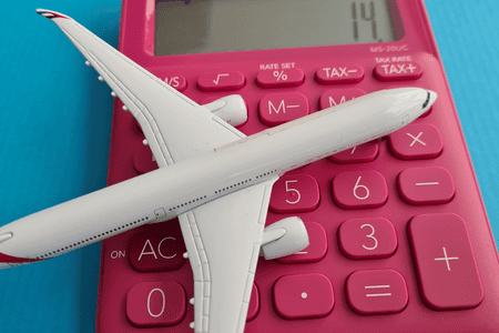 airplane model on top of calculator