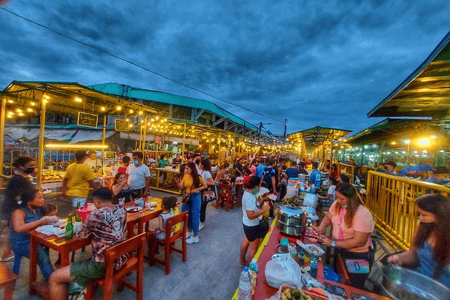 Carbon Night Market with people dining and enjoying various foods
