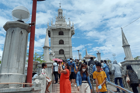 Simala Shrine bustling with pilgrims and devotees on a sunny day