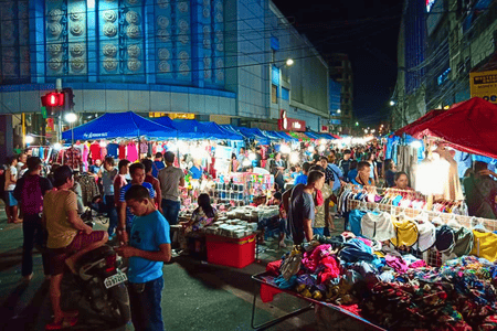 People shopping at the Colon night market