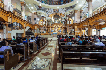 People hearing mass at Simala Shrine