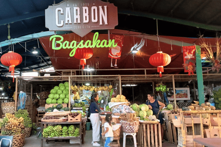 Carbon market with fresh fruits (bananas, watermelons, pineapples, etc.) on display