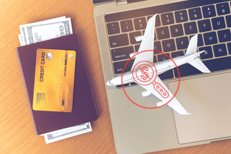 toy plane on a laptop stamped with "no hidden fee" logo