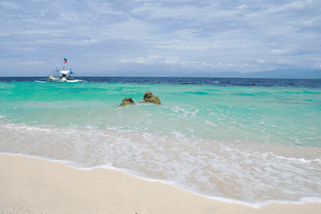 white beach and clear waters in Moalboal, Cebu